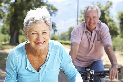 older happy seniors riding bicycles